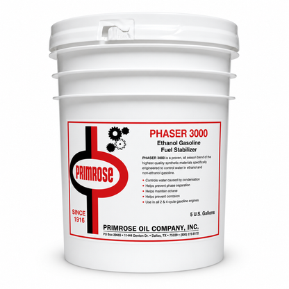 Primrose Phaser 3000 Ethanol Gasoline Fuel Stabilizer in a white 5 US gallon pail. Controls water caused by condensation, helps prevent phase separation, helps maintain octane, helps prevent corrosion, for all 2 and 4 cycle gasoline engines.
